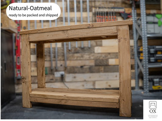 A rustic natural oak wooden workbench with a single shelf, shown in a workshop setting with a text overlay reading 'Natural-Oatmeal ready to be packed and shipped'.